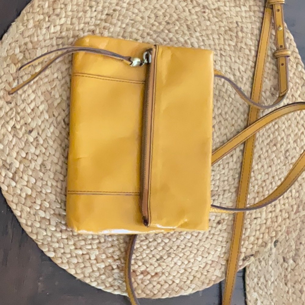 HOBO mustard colored small crossbody bag.